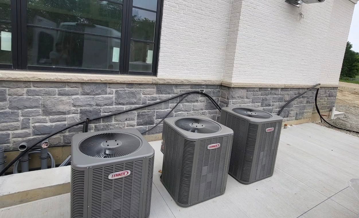 Lennox AC condensers installed outside a GTA home